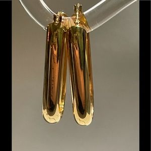 Electroplated gold oblong earrings 1.5 inch drop. Flatters the face.
